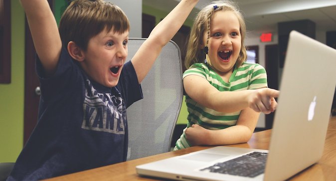 Excited kids at a computer